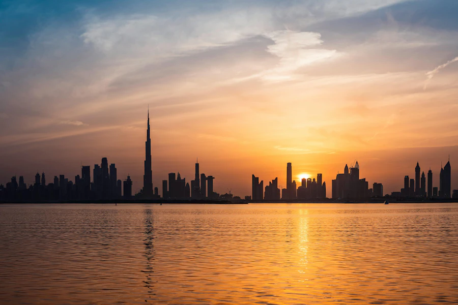 Dubai skyline at sunset across the water
